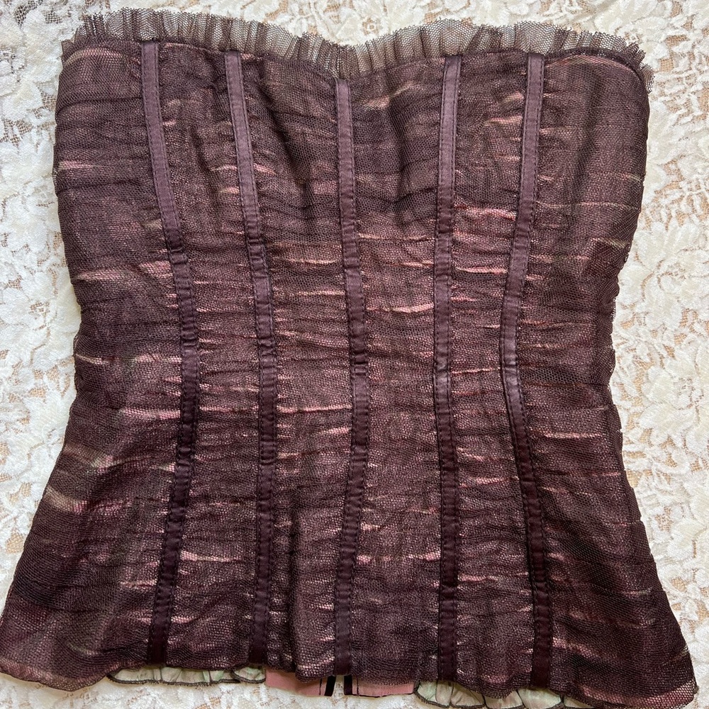 Cute ruffled corset top.